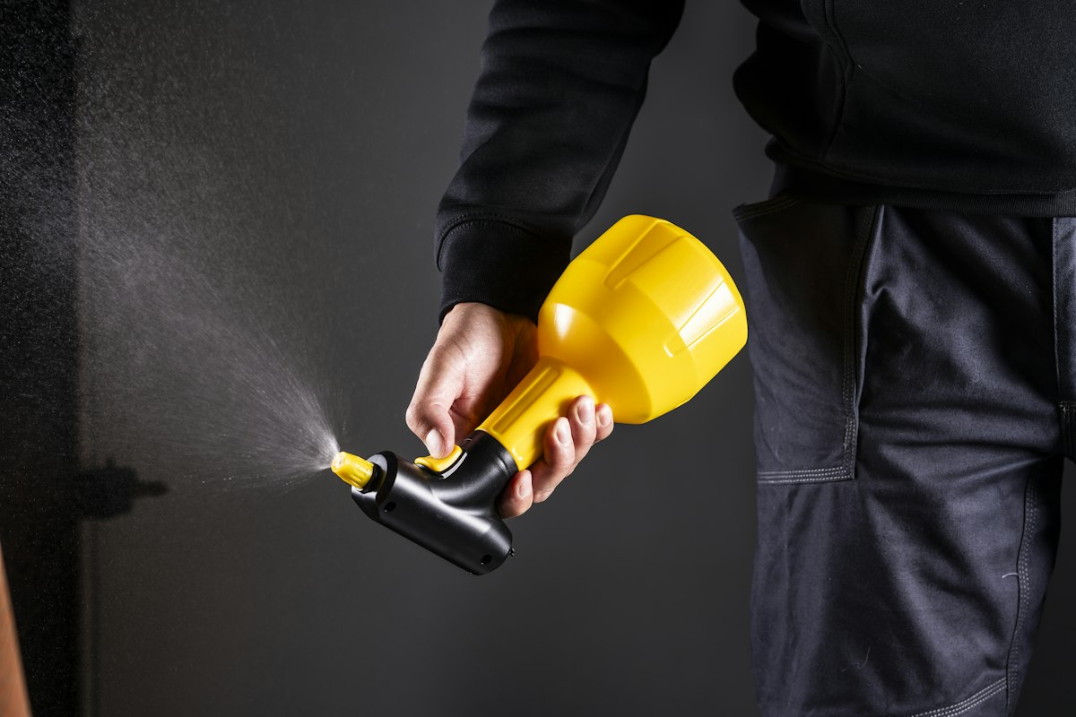 Pest control technician applying a targeted treatment
